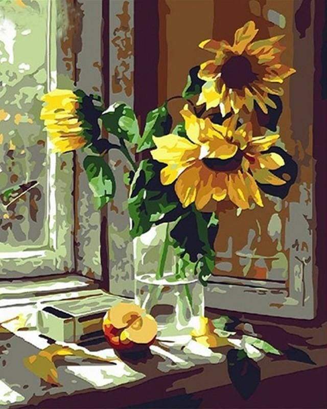 Sunflowers and apple in front of the window